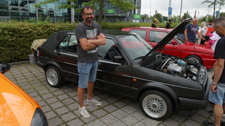 Volkswagen Golf Limited at GTI FanFest with Rajan Paymaster in front of his car.